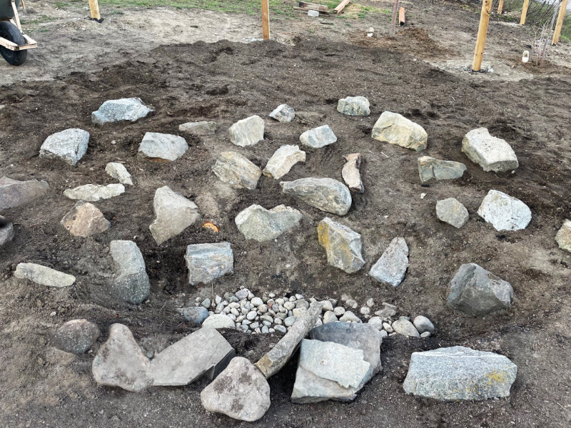 situating rocks in the new rockery 