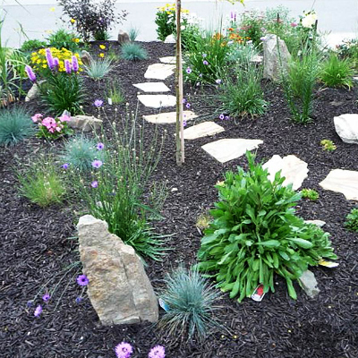 Mulch to conserve water in a xeriscape garden